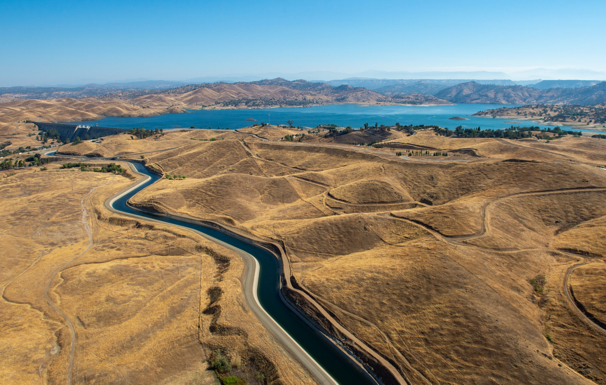 An aerial view of Millerton Lake and Friant Dam, located 16 miles northeast of Fresno, California, which provides flood control, conservation storage, and water releases into the Madera and Friant-Kern canals and delivers water to millions of agricultural lands in Fresno, Kern, Madera and Tulare counties. Photo taken August 8, 2013.