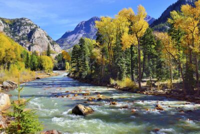 mountain river and colourful mountains of Colorado during foliage season