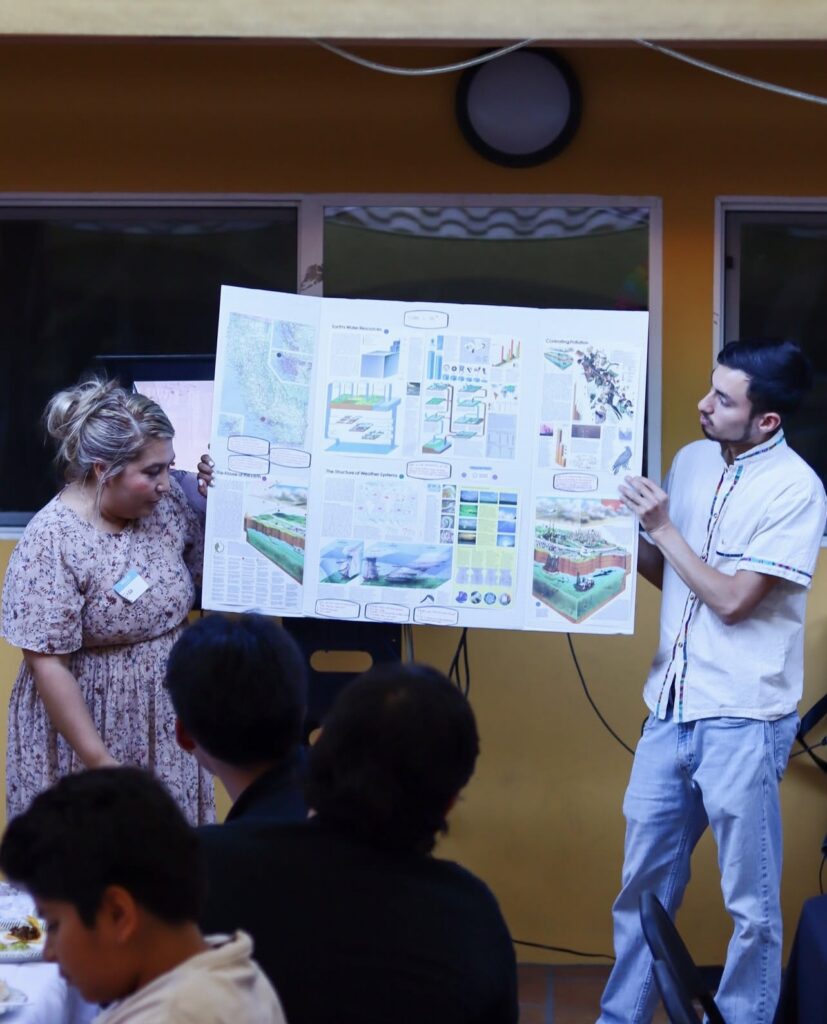 Pacoima Beautiful, two people presenting capstone projects for People's Collaborative Academy