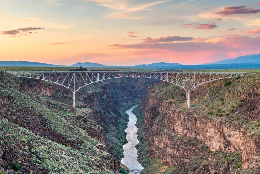 Taos, New Mexico, USA at Rio Grande Gorge Bridge over the Rio Grande at dusk